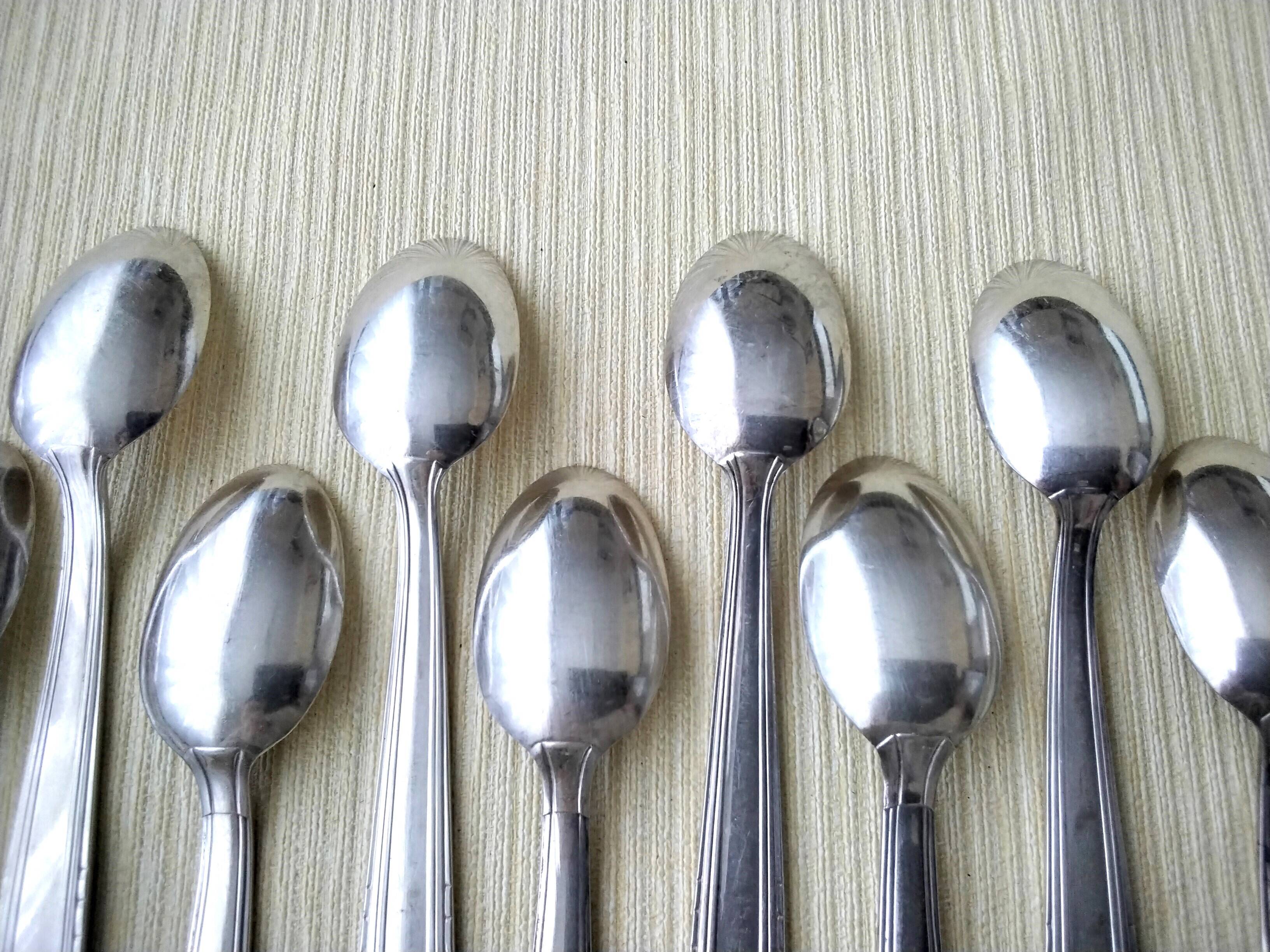 Set of 2 x 6 silver metal spoons 2 different models