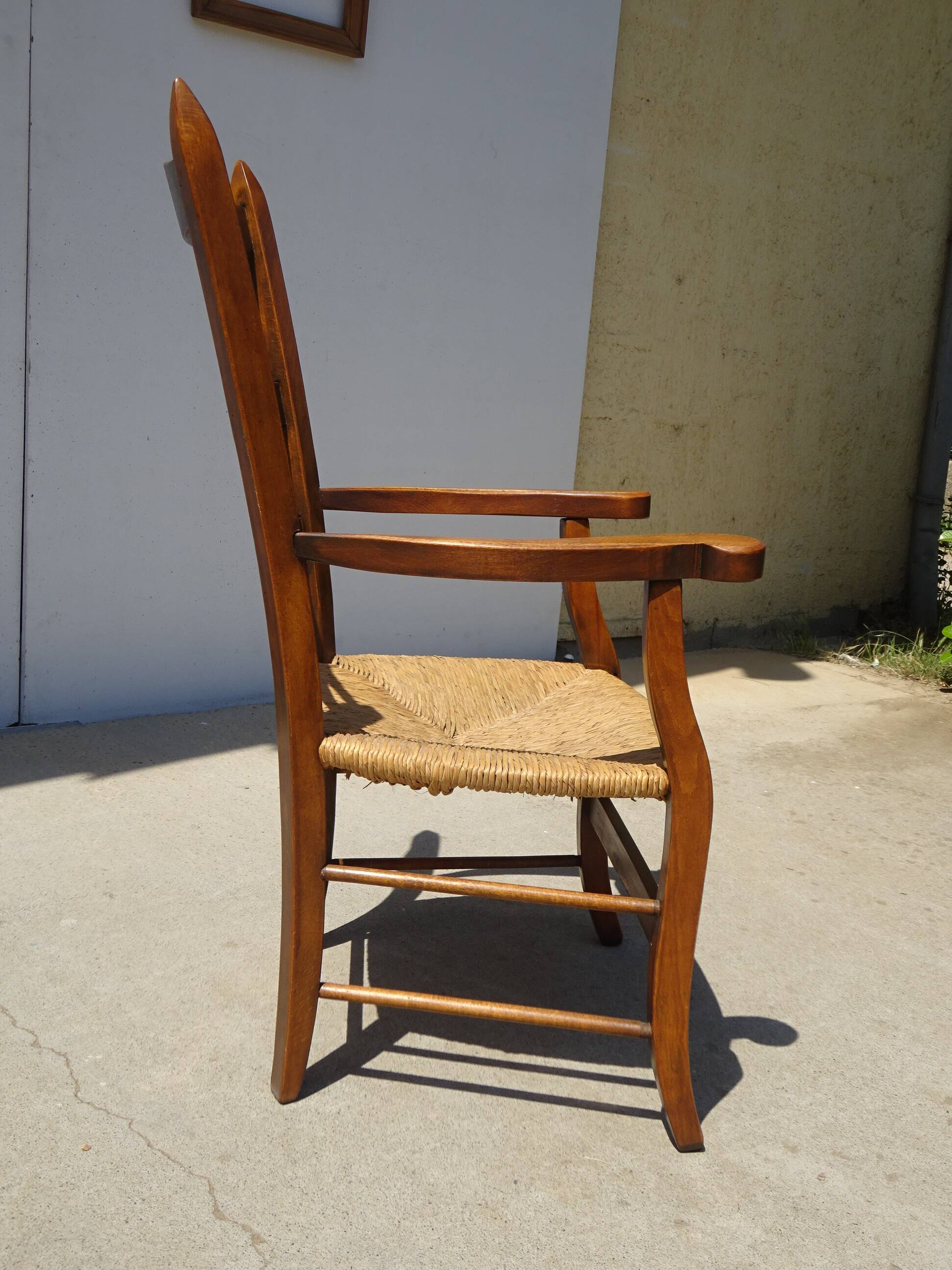 solid wood armchair, straw-covered seat