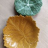 Two earthenware plates, a vine leaf and a cabbage slip