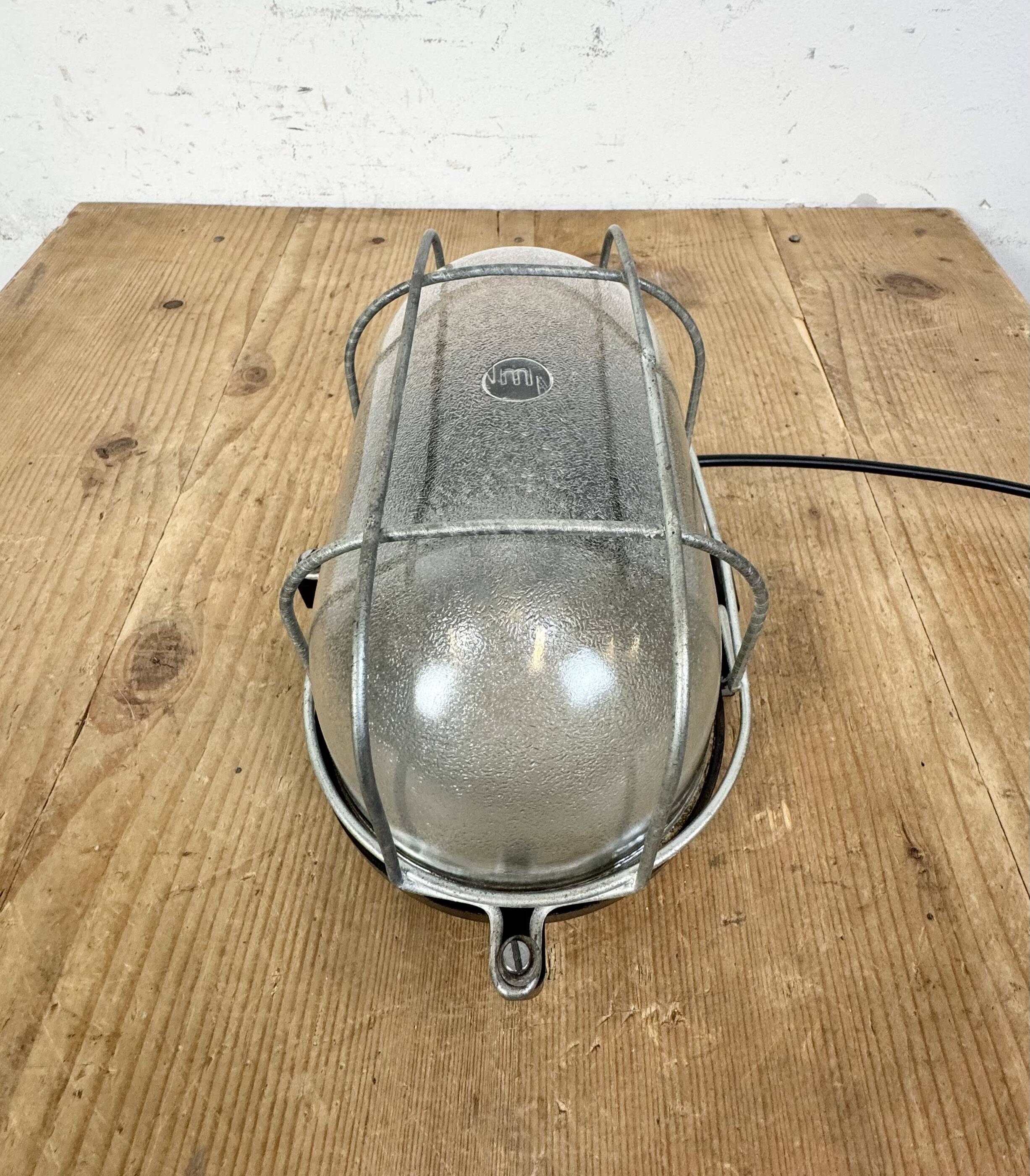 Industrial brown bakelite wall light with frosted glass, 1960s