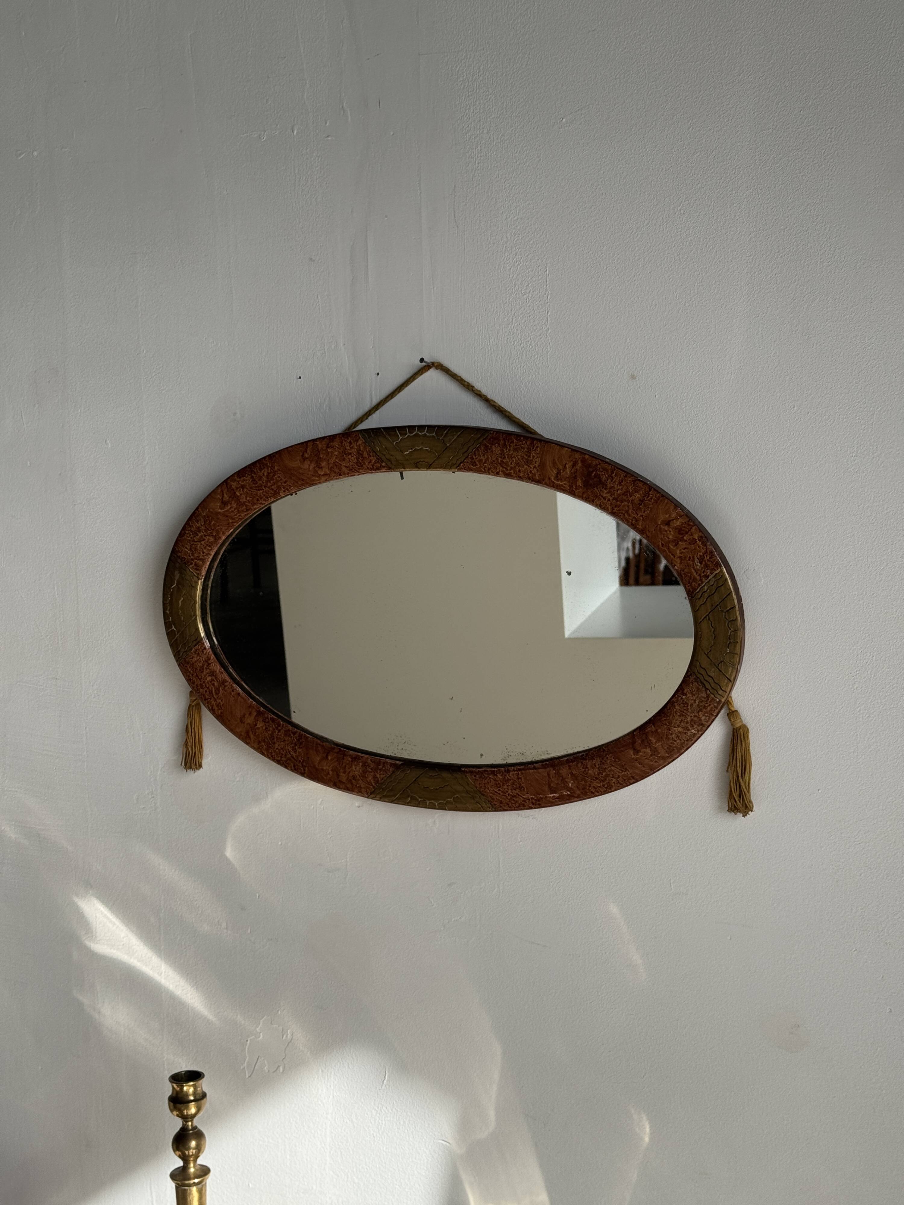Small oval Art Deco mirror in brown and gold 33x54.