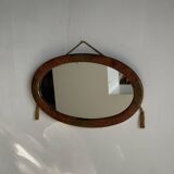 Small oval Art Deco mirror in brown and gold 33x54.