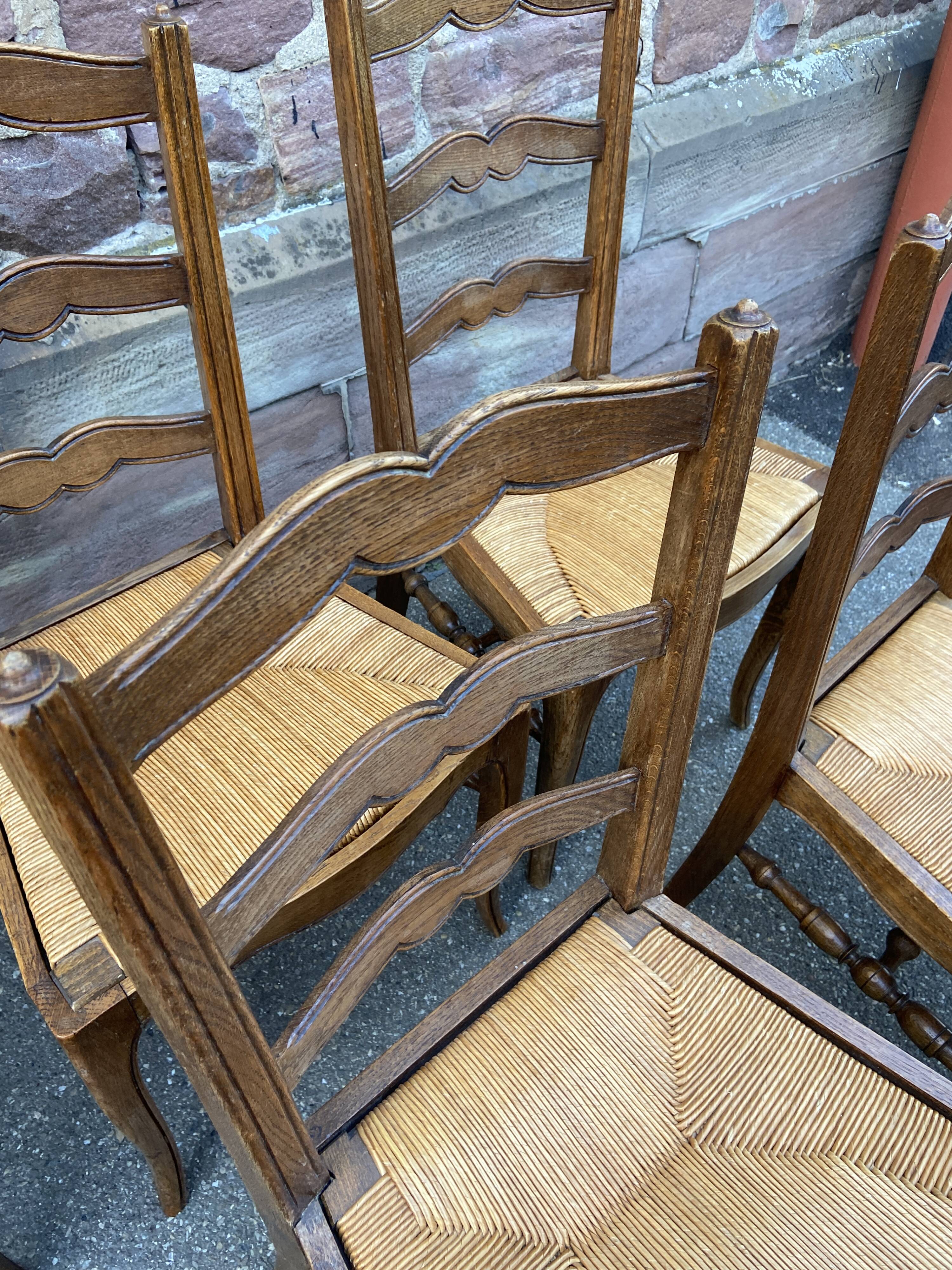 8 vintage rustic mulched chairs