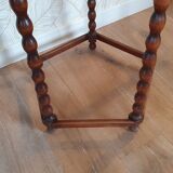 Round wooden table with beaded legs
