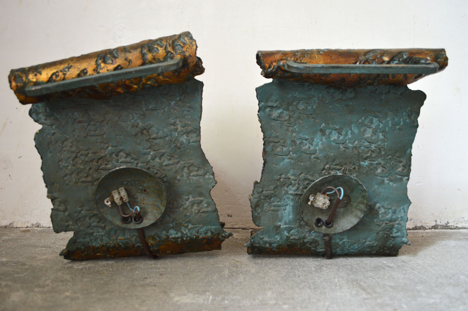Pair of patinated wrought iron sconces