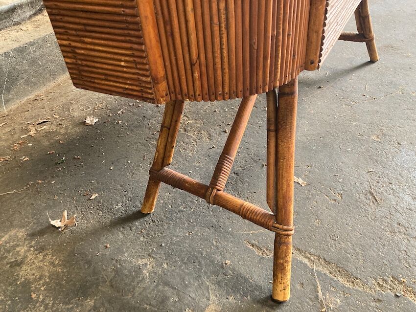 Rattan and wood bar with its decorative brass portholes