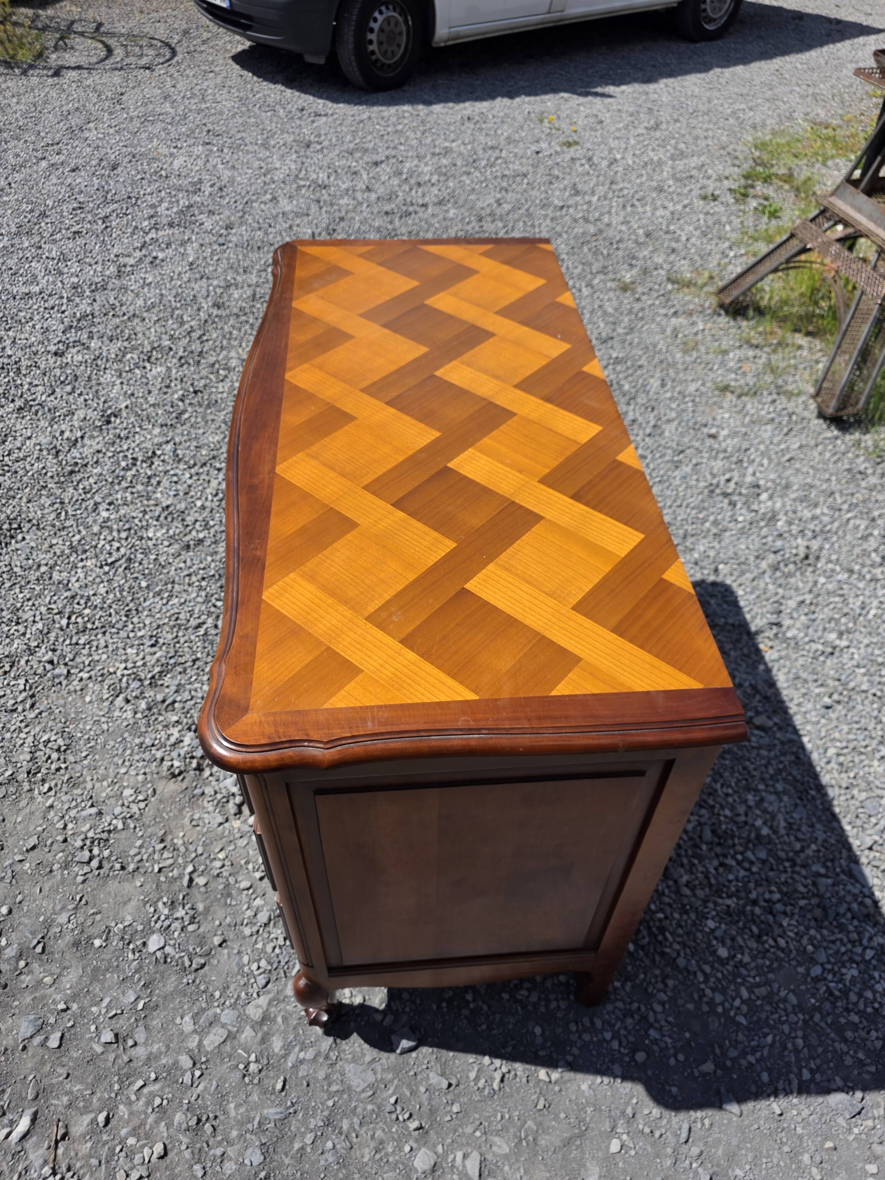 Curved commode in Louis XV style made of cherry wood.
