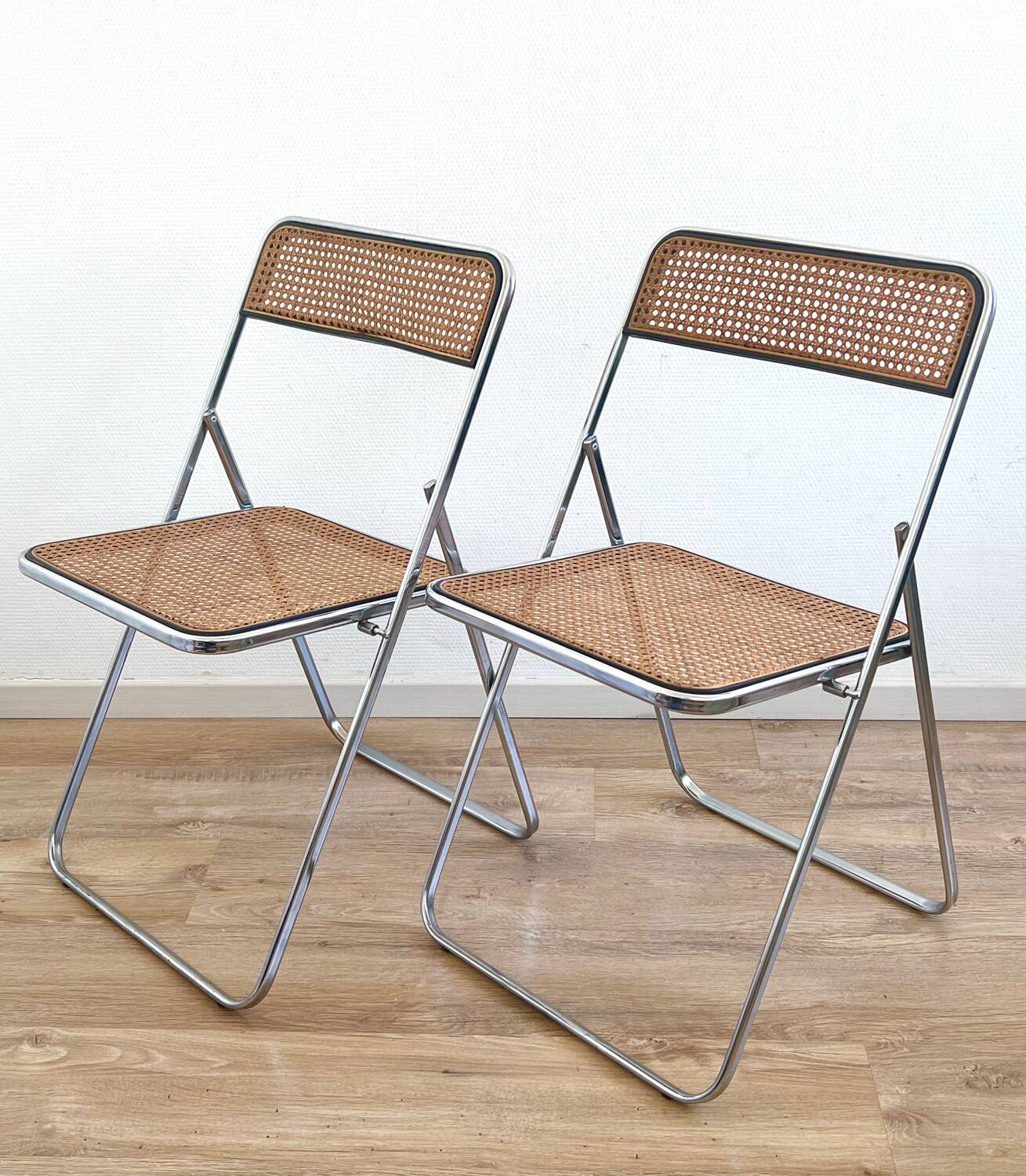 Pair of folding cane chairs