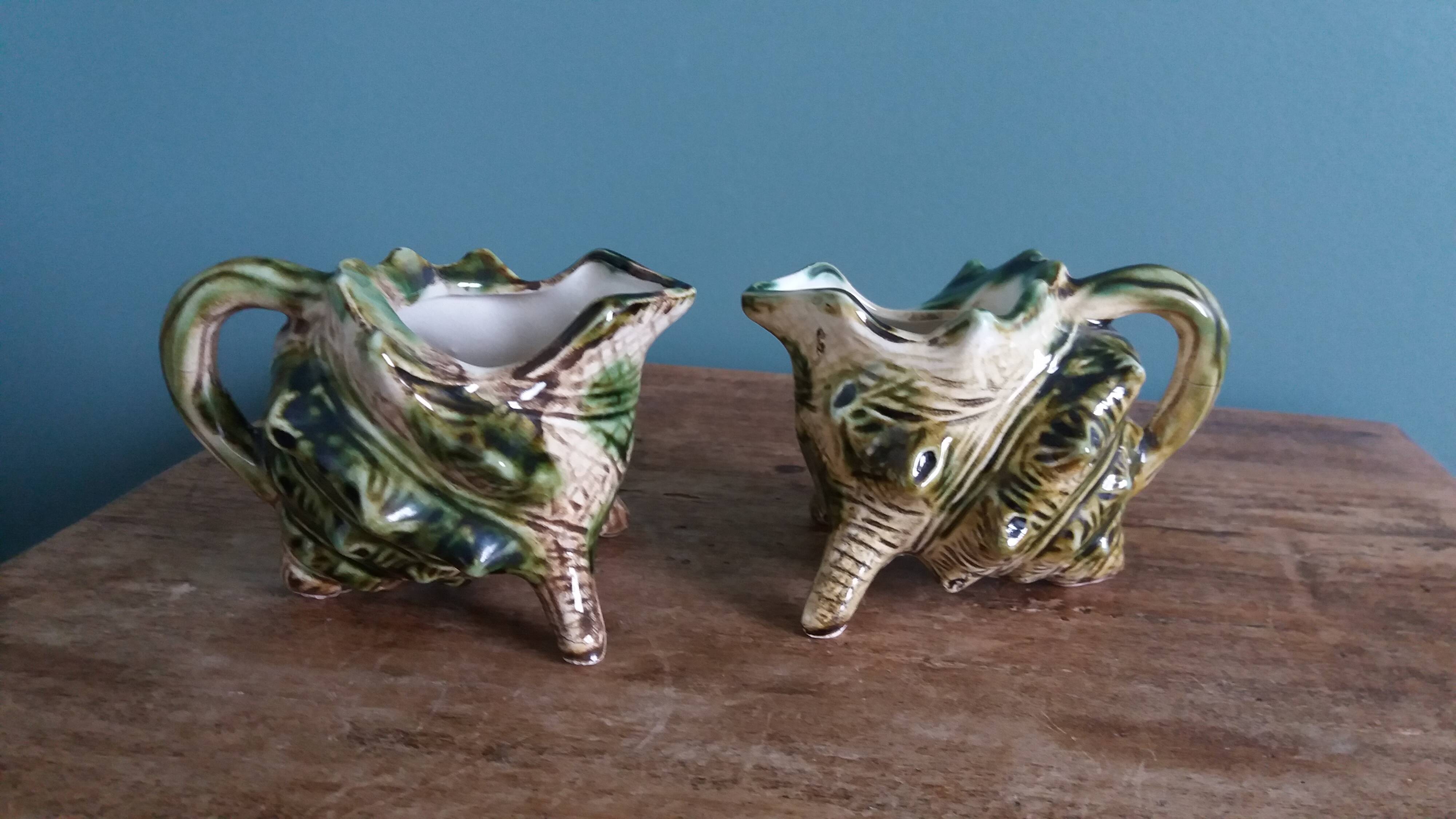 Animal-shaped milk jug shell in slipware.
