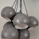 Khaki lamp with 7 bulbs.