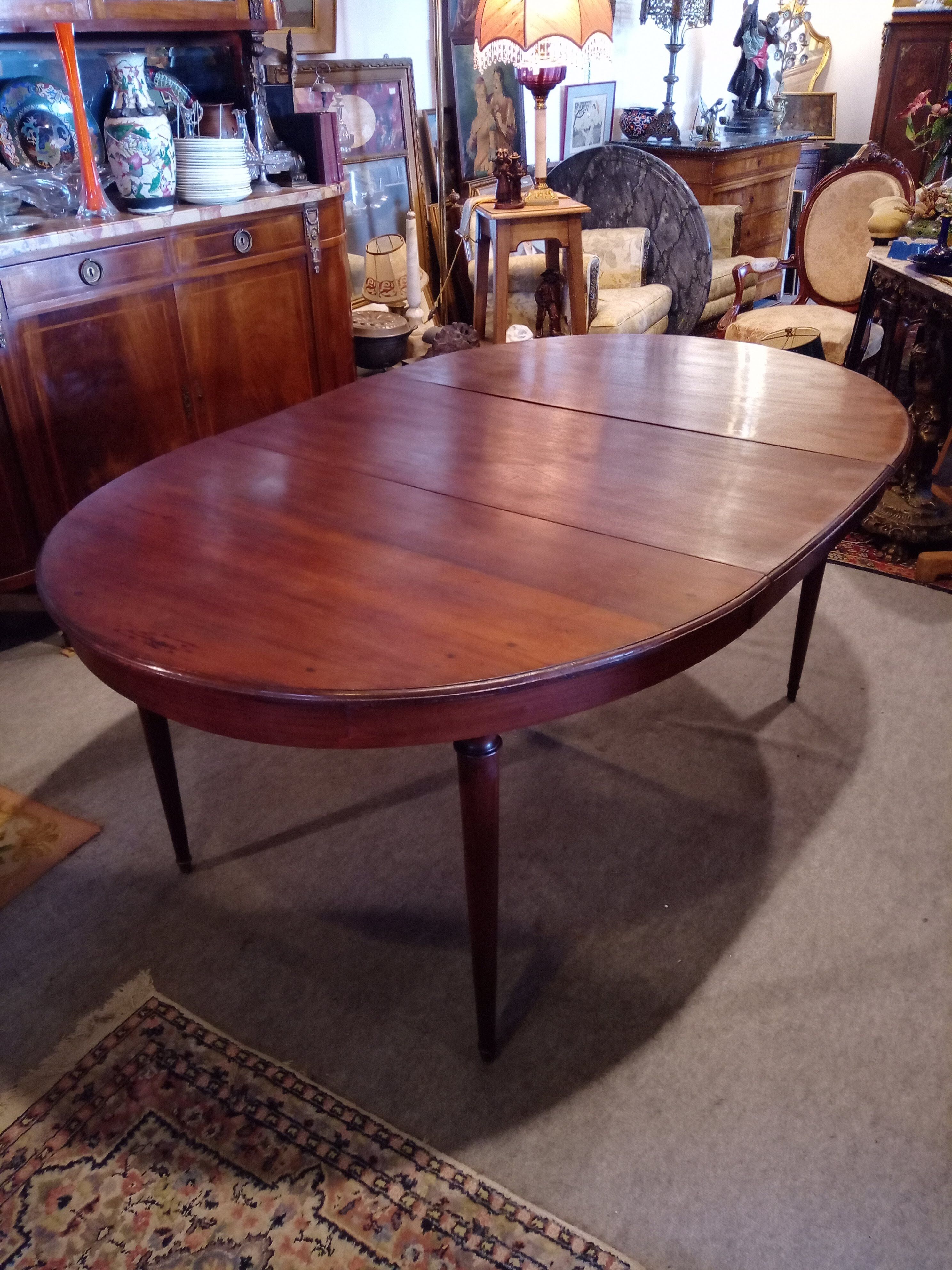 Oval mahogany table with extension cords