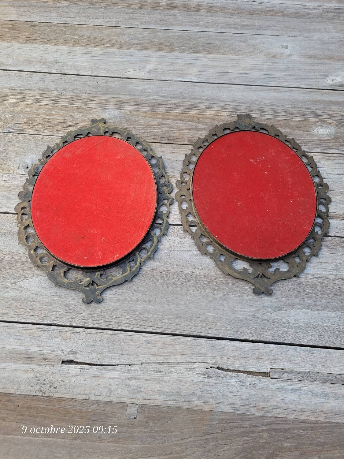 2 antique oval mirrors in heavy metal