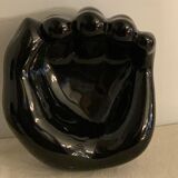 Black ceramic ashtray left hand