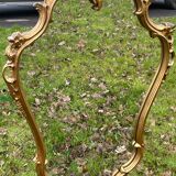 Louis XV Style wood and gilded stucco mirror with animated shape