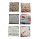 A set of 6 mismatched floral and bird-themed napkins