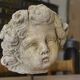 Reconstituted stone sculpture in antique style from the 20th century.