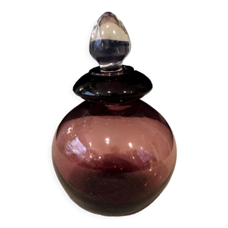 Perfume bottle in purple and transparent glass