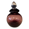Perfume bottle in purple and transparent glass