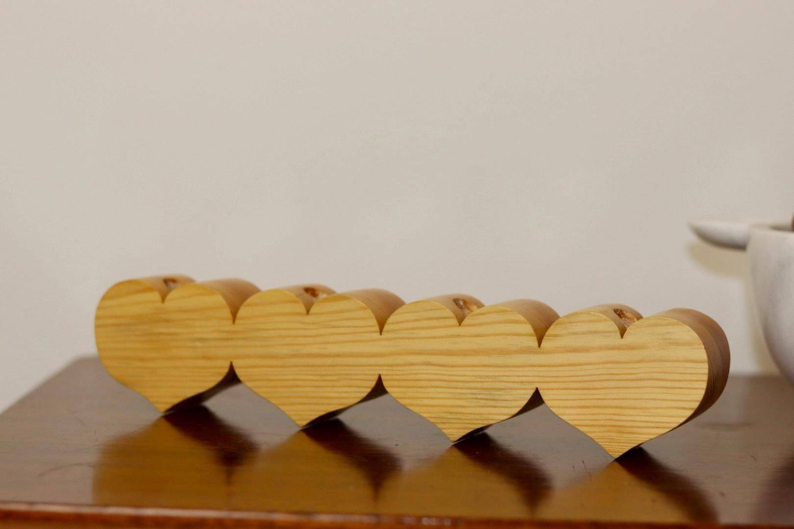 Heart-shaped chandelier made of Swedish pine wood.