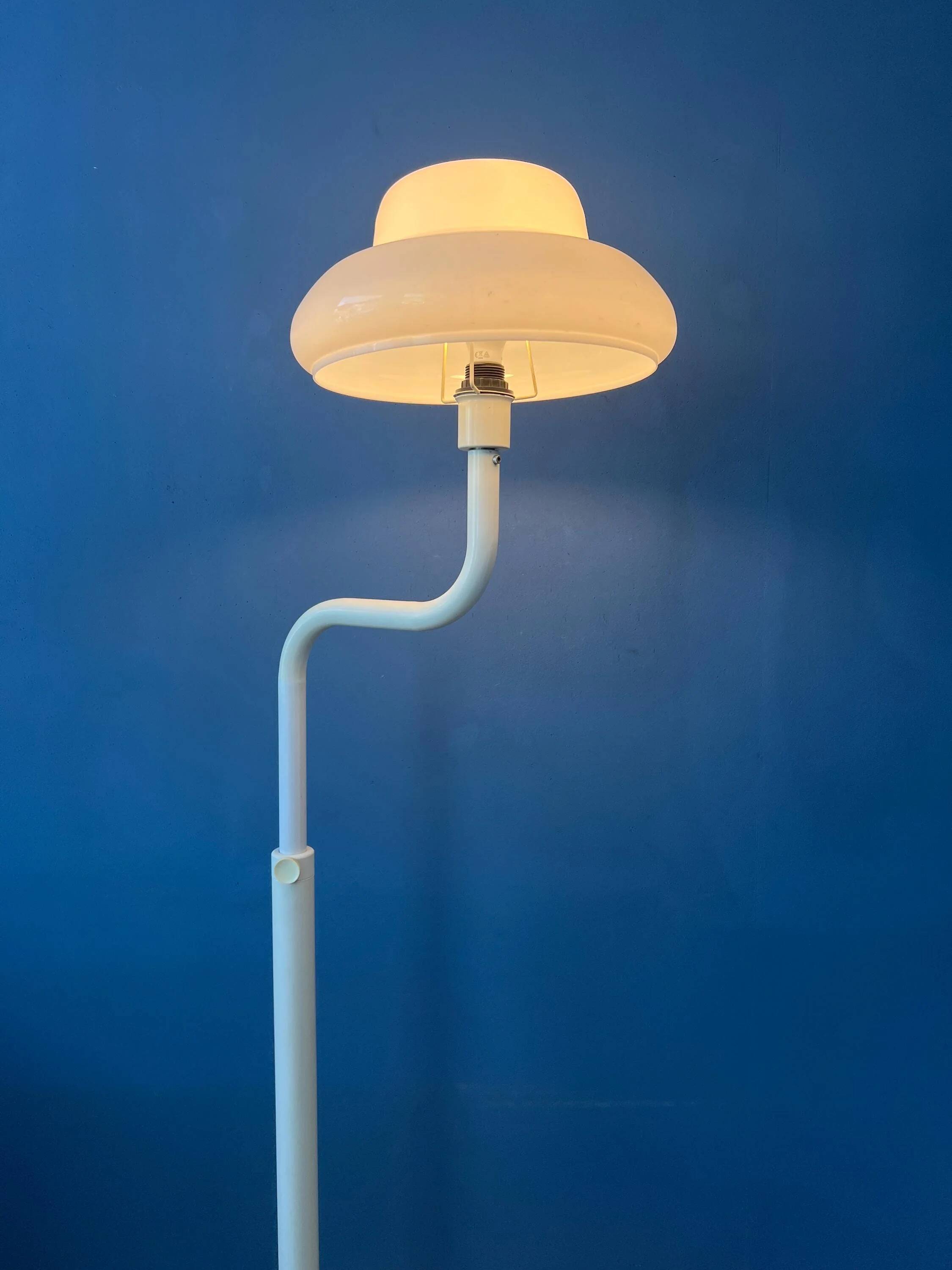Mid-century mushroom floor lamp with a white plexiglass shade.