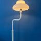 Mid-century mushroom floor lamp with a white plexiglass shade.