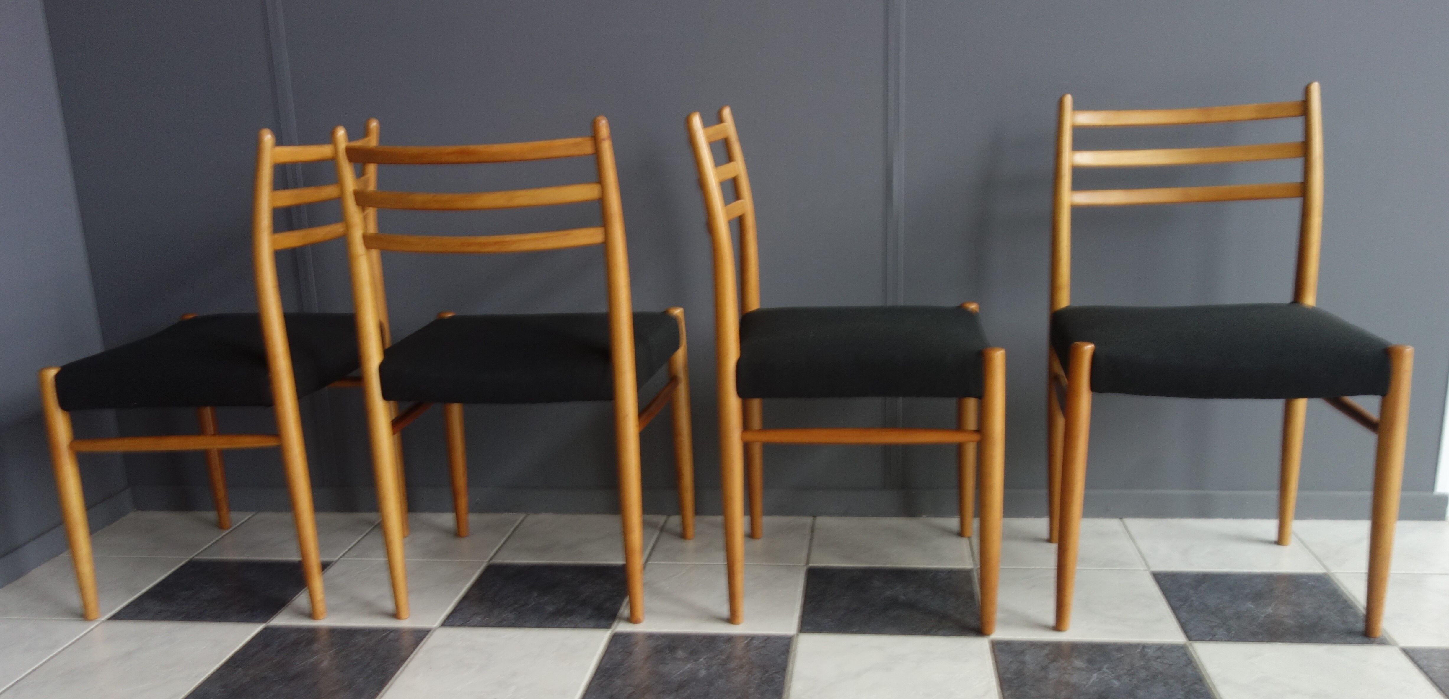 Set of 4 dining chairs in wood and black fabric 1960s