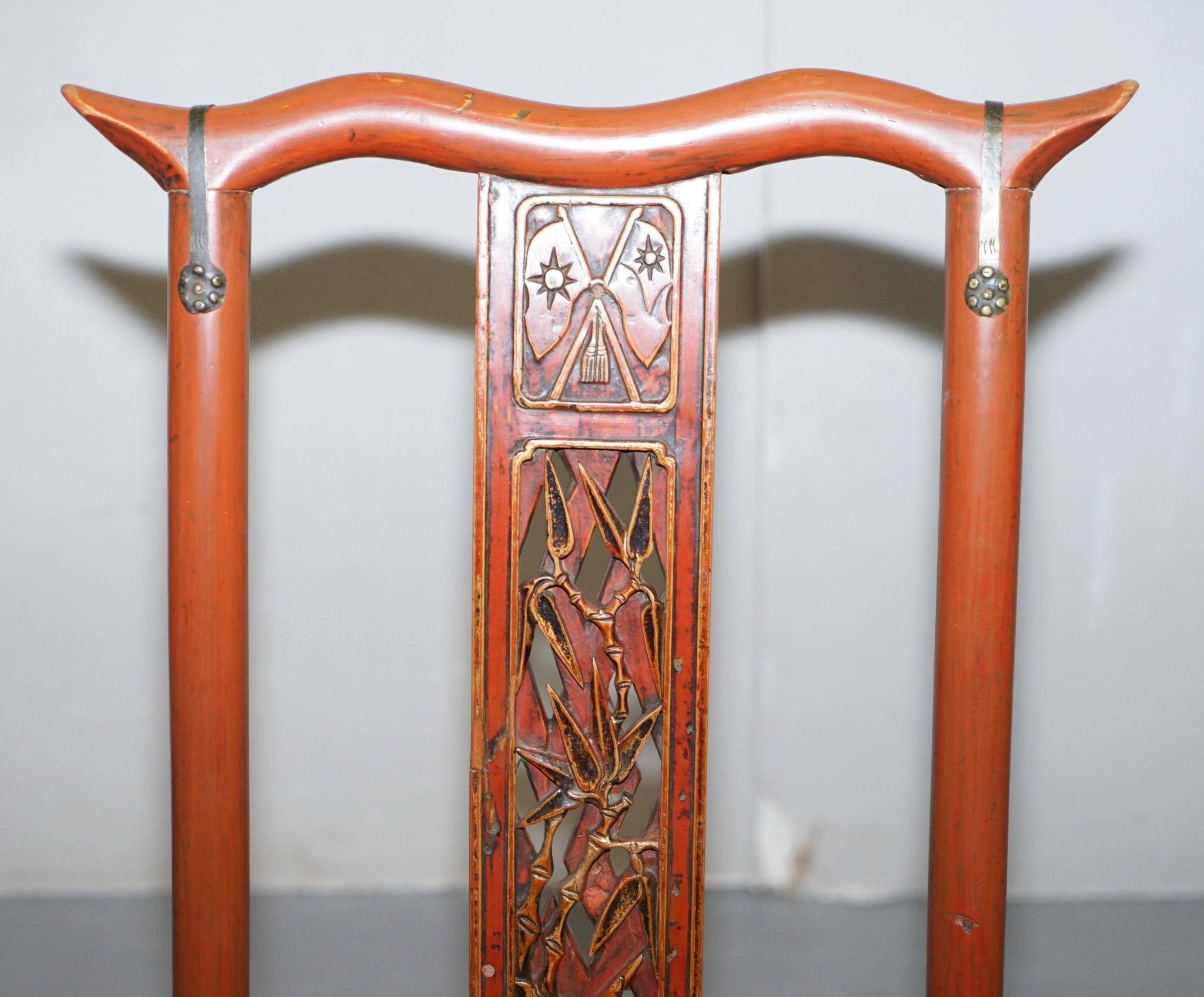 Antique Chinese folding chair with carvings, circa 1900-1920.