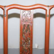 Antique Chinese folding chair with carvings, circa 1900-1920.