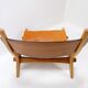 Vintage Scandinavian-style lounge chair in wood and leather