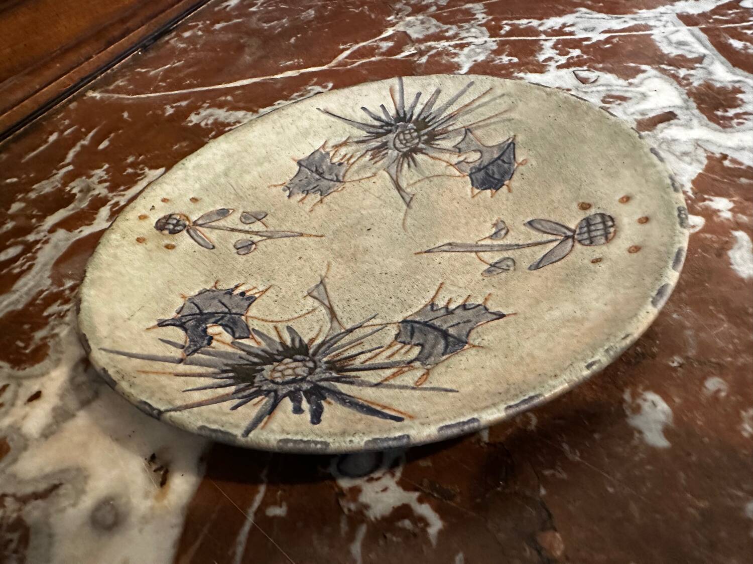 Ceramic plate signed by Marie-Madeleine Jolly – thistle decoration – year