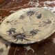 Ceramic plate signed by Marie-Madeleine Jolly – thistle decoration – year