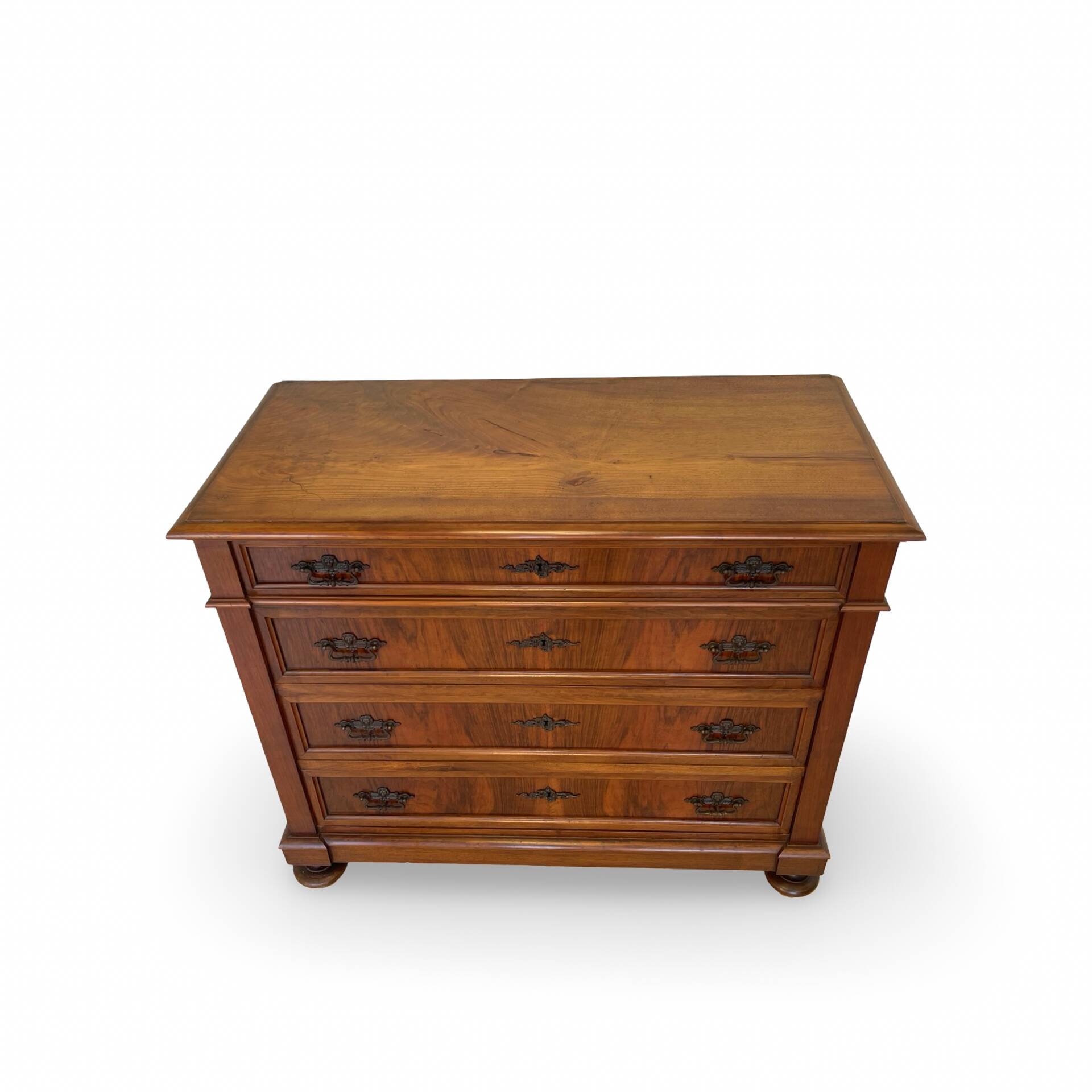 Antique walnut commode with bronze handles in the shape of a lion's mask,