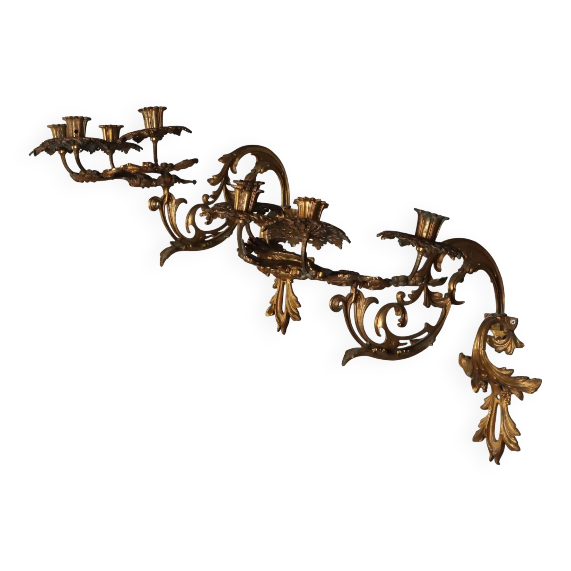 Antique wall sconces in gilded bronze, 20th century, in baroque style.