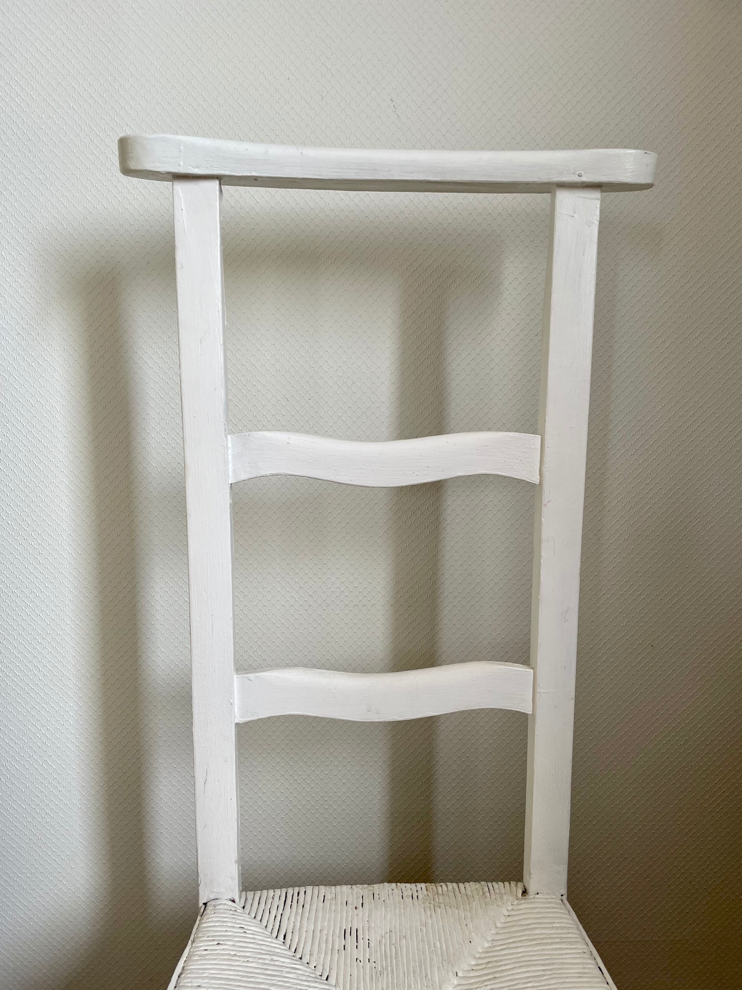 Old white mulched wooden chair