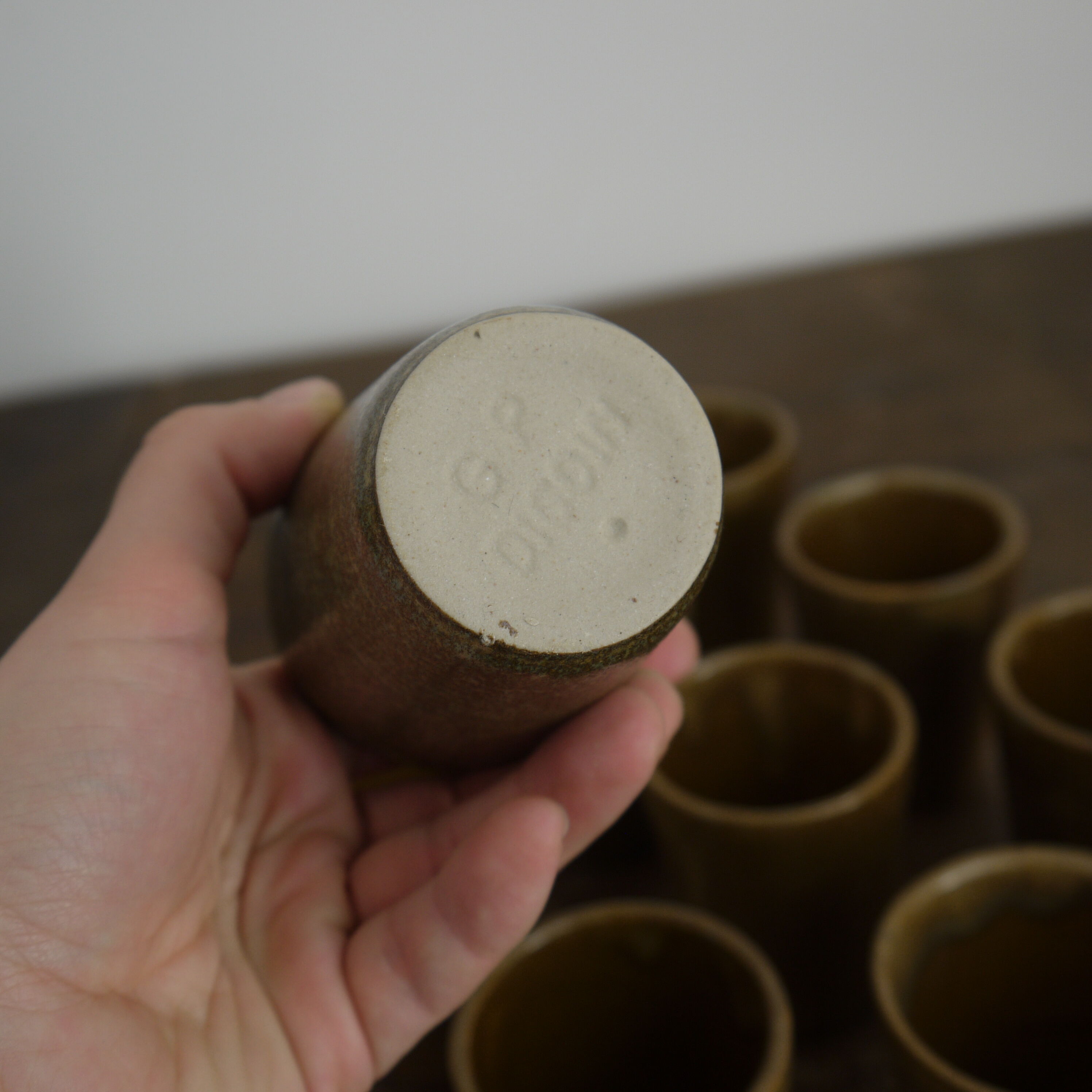 Lot of ten cups of Digoin sandstone