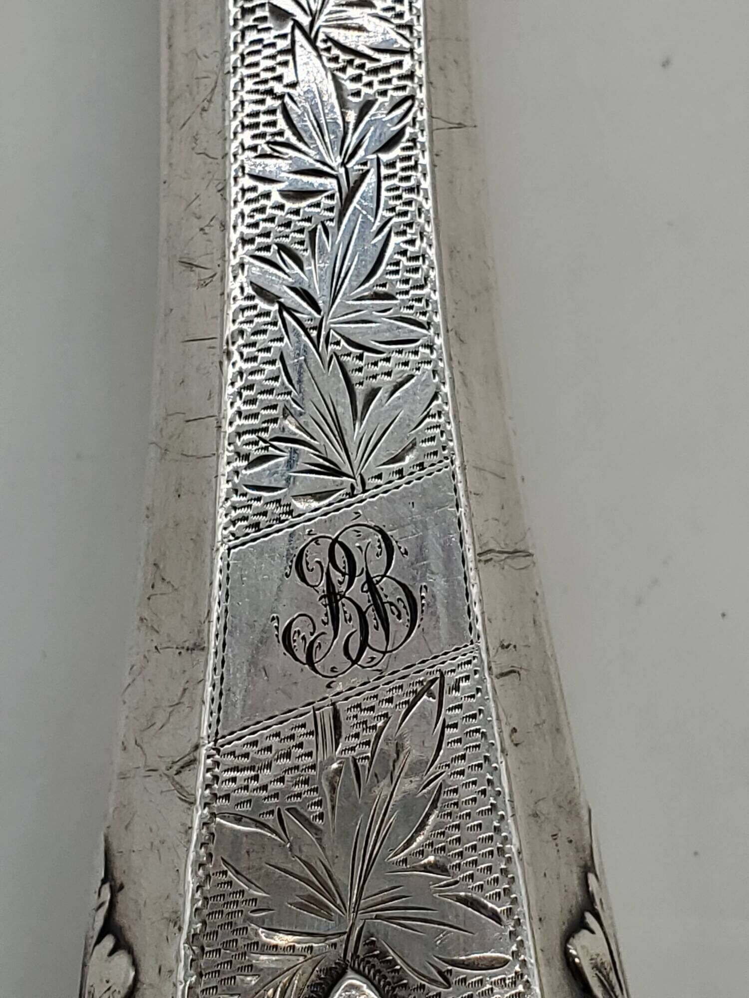 Set of serving forks and silver-plated leg of lamb fork.