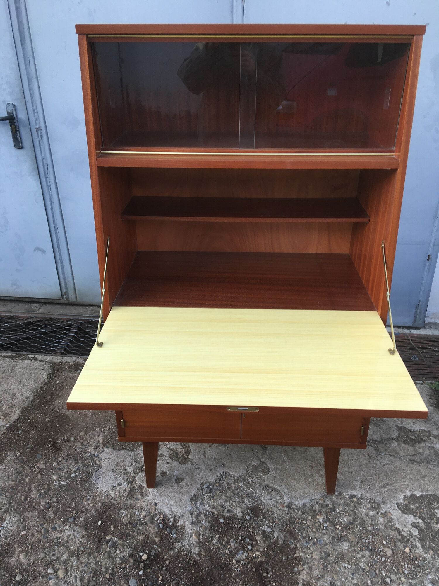 Vintage secretary with wooden compass feet with felling, shop window and closet