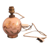 Antique lamp base with globe from the early 20th century.