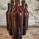 Set of 10 bottles of old Bordeaux French wine in ruby brown glass, 19th century.