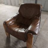 Armchairs in leather and vintage wood 70's