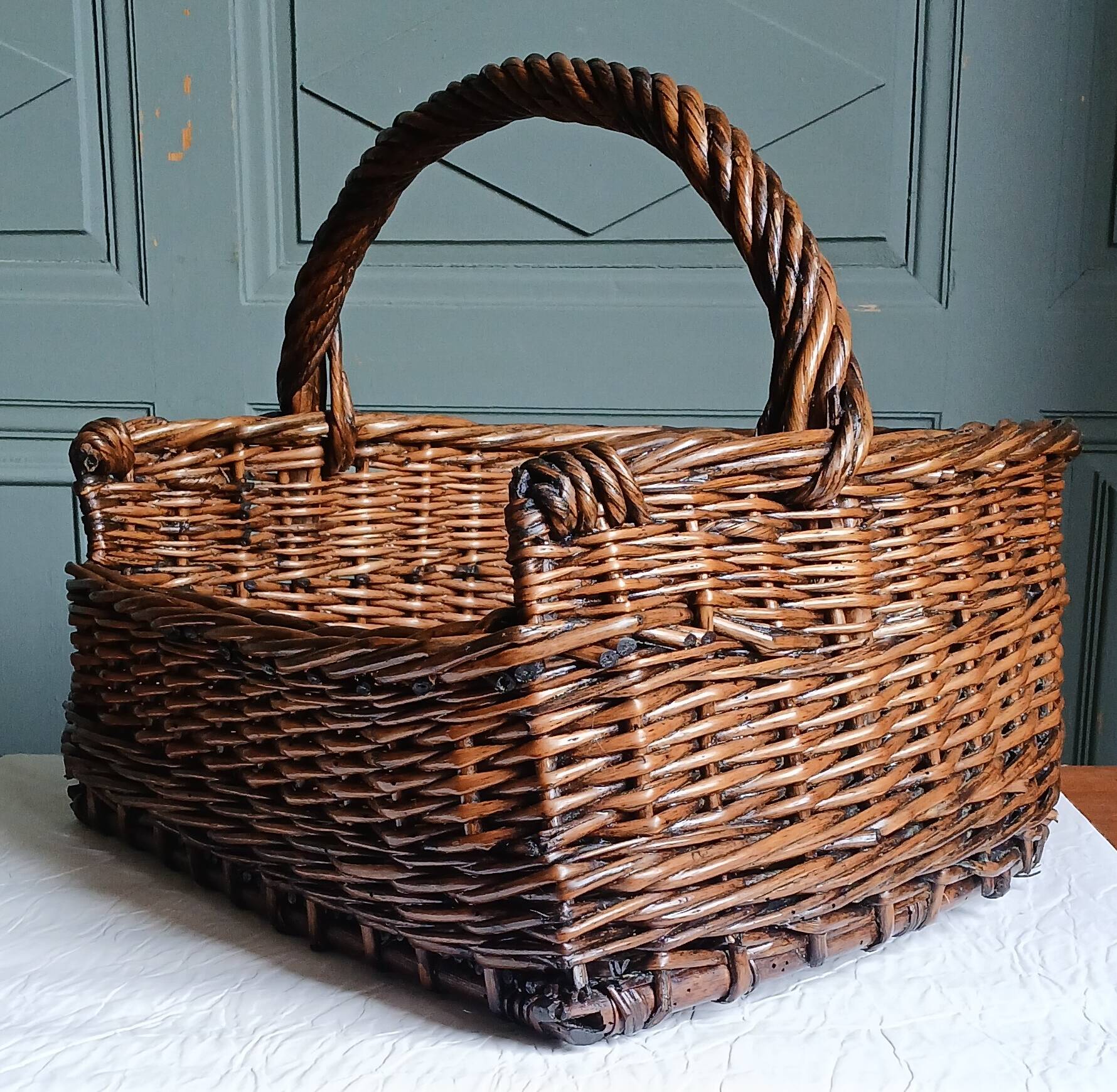 Handmade woven and dyed willow harvest basket.