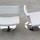 Pair of postmodern swivel armchairs in leather and chrome, Italy 1970s.