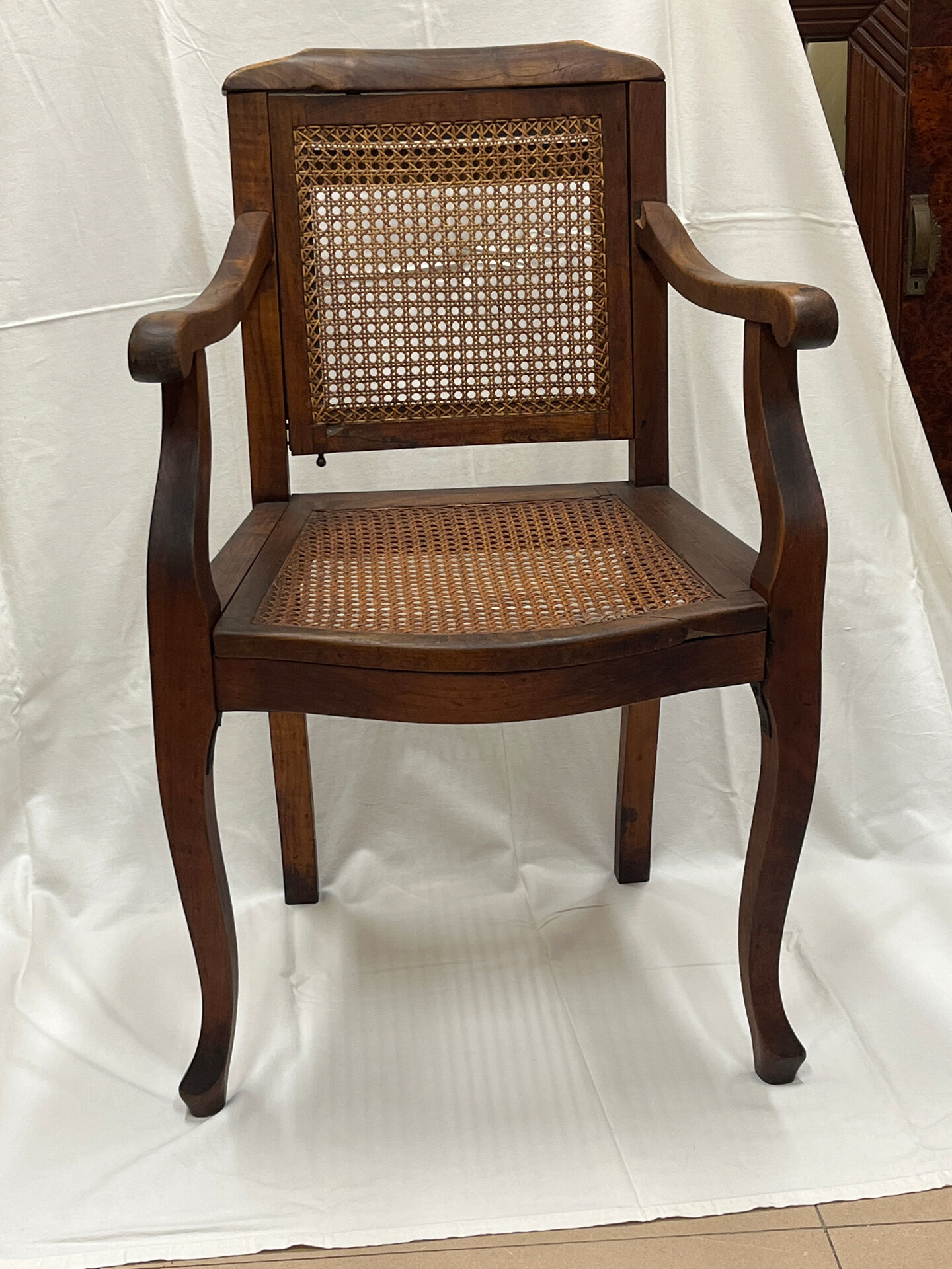 Caned armchair