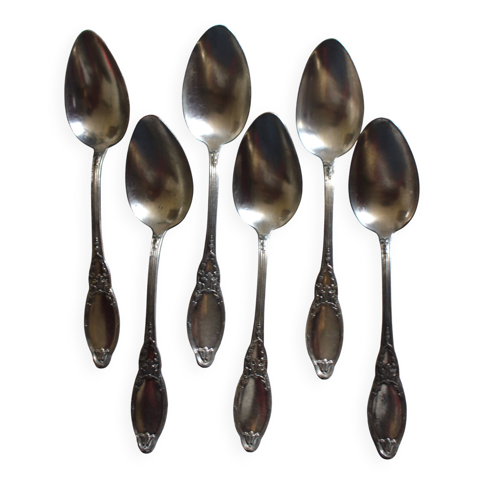 A set of 6 silver-plated metal soup spoons with foliage design.