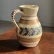 Beige carafe with stylized blue flower friezes