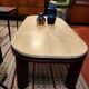 Coffee table Travertine top, garnet-colored metal stand and legs.  Long