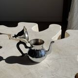 Silver-plated teapot with black handle