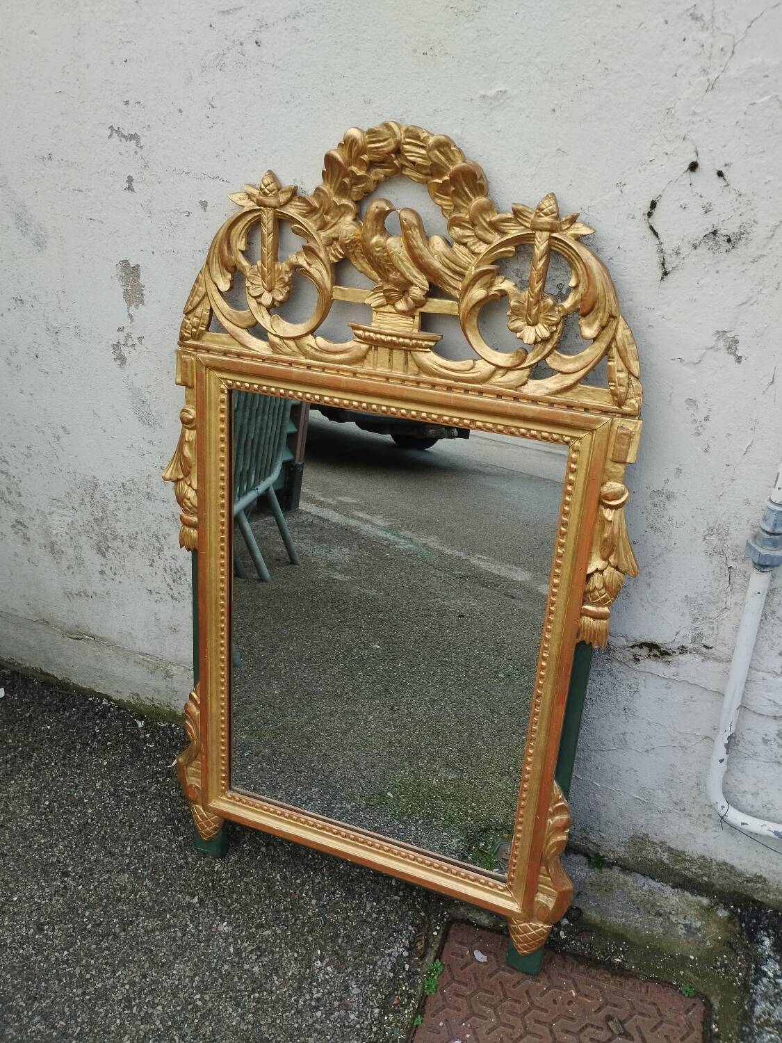 Antique gilded wooden mirror in Louis XVI style