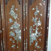 Asian screen in carved wood and mother-of-pearl marquetry.