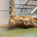 Louis XV period wooden and gilded stucco mirror, 18th century